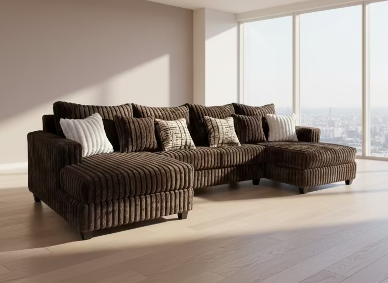Brown sectional sofa with decorative pillows in a furniture store setting.